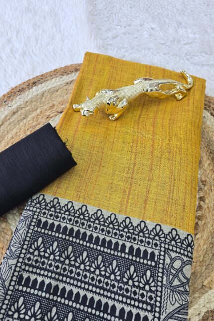 Mustard Yellow Linen Cotton Madhubani Print Saree with traditional black and beige ethnic motifs, artistic printed pallu and border, matching black blouse fabric, festive wear saree for women.