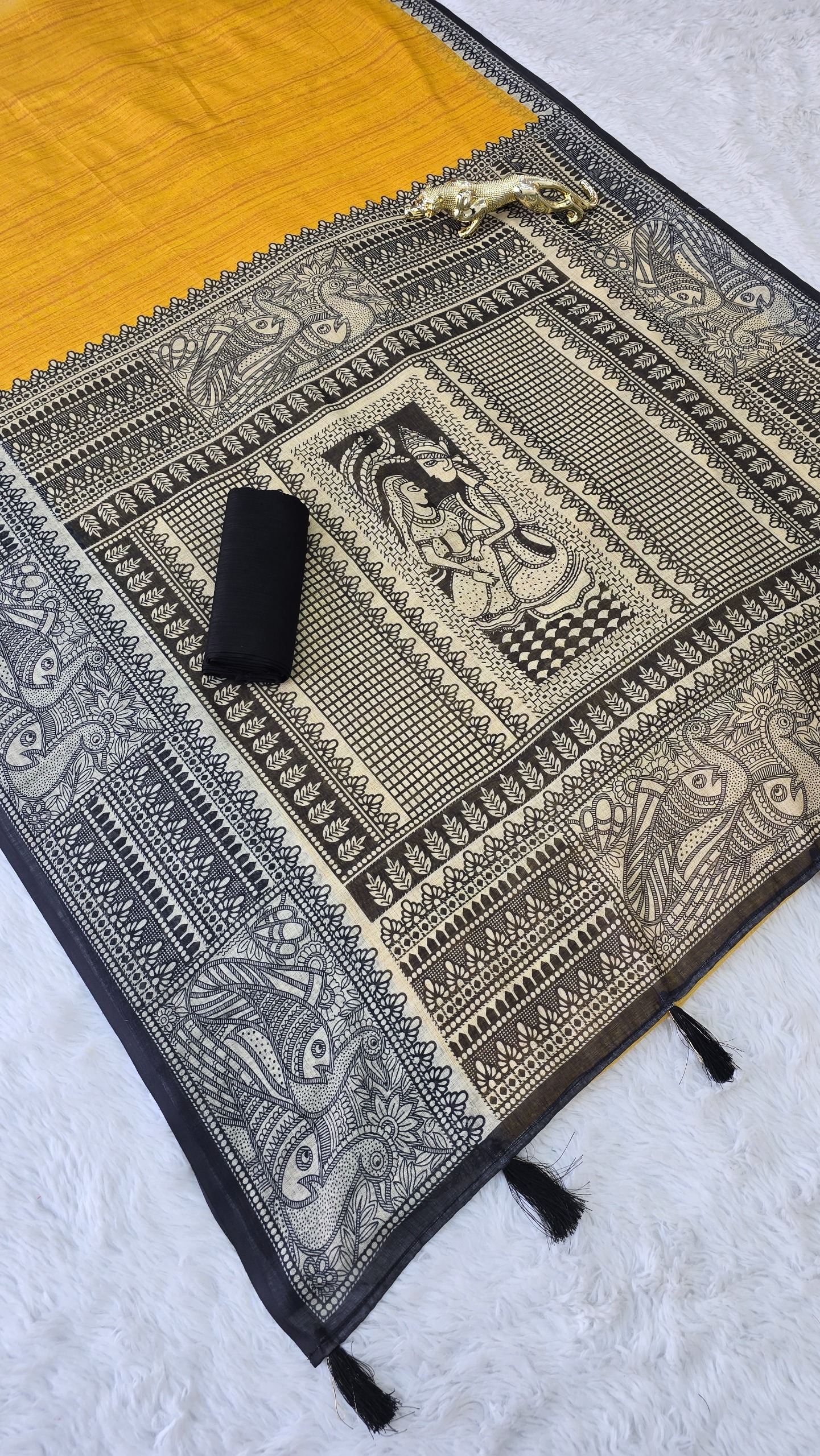 Mustard Yellow Linen Cotton Madhubani Print Saree with traditional black and beige ethnic motifs, artistic printed pallu and border, matching black blouse fabric, festive wear saree for women.