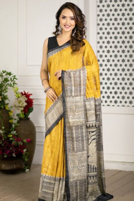 Mustard Yellow Linen Cotton Madhubani Print Saree with traditional black and beige ethnic motifs, artistic printed pallu and border, matching black blouse fabric, festive wear saree for women.