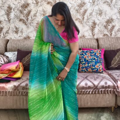 Multicolor Chiffon Saree featuring vibrant gradient shades, stylish wavy stripe pattern, lightweight flowing fabric, and graceful drape, perfect for festive wear, parties, brunch outings, and special occasions.
