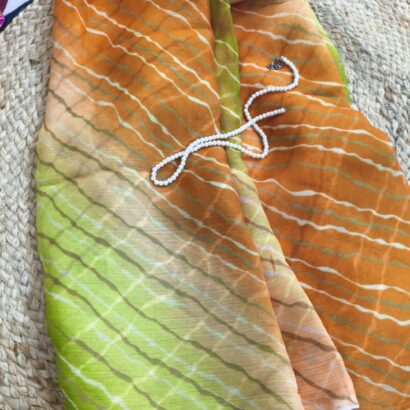 Multicolor Chiffon Saree featuring vibrant gradient shades, stylish wavy stripe pattern, lightweight flowing fabric, and graceful drape, perfect for festive wear, parties, brunch outings, and special occasions.