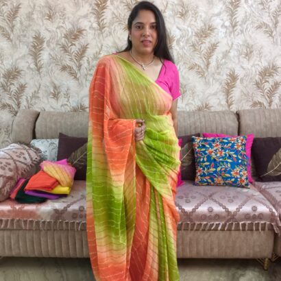 Multicolor Chiffon Saree featuring vibrant gradient shades, stylish wavy stripe pattern, lightweight flowing fabric, and graceful drape, perfect for festive wear, parties, brunch outings, and special occasions.