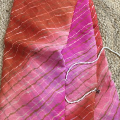Multicolor Chiffon Saree featuring vibrant gradient shades, stylish wavy stripe pattern, lightweight flowing fabric, and graceful drape, perfect for festive wear, parties, brunch outings, and special occasions.