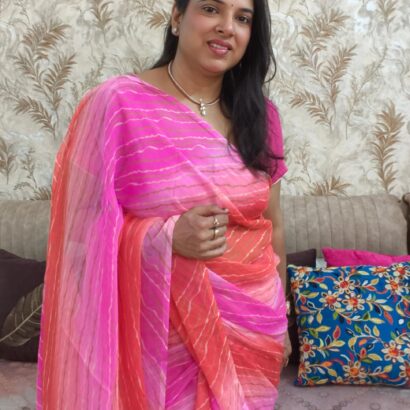 Pink Multicolor Chiffon Saree featuring vibrant gradient shades, stylish wavy stripe pattern, lightweight flowing fabric, and graceful drape, perfect for festive wear, parties, brunch outings, and special occasions.