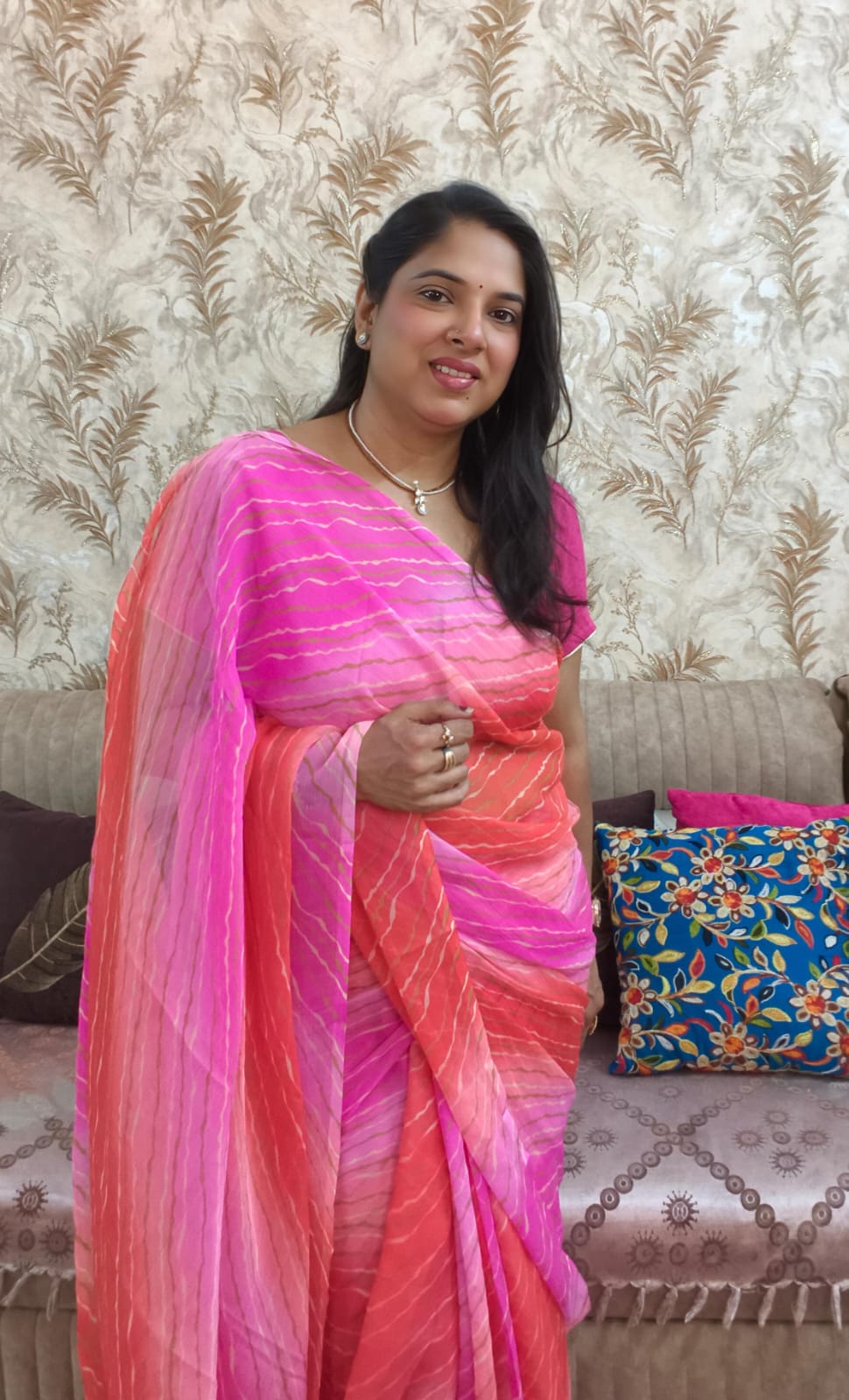 Pink Multicolor Chiffon Saree featuring vibrant gradient shades, stylish wavy stripe pattern, lightweight flowing fabric, and graceful drape, perfect for festive wear, parties, brunch outings, and special occasions.
