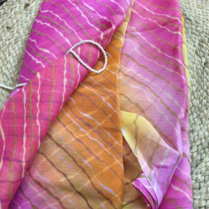 Multicolor Chiffon Saree featuring vibrant gradient shades, stylish wavy stripe pattern, lightweight flowing fabric, and graceful drape, perfect for festive wear, parties, brunch outings, and special occasions.