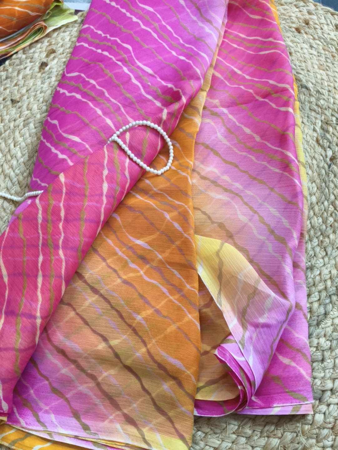 Multicolor Chiffon Saree featuring vibrant gradient shades, stylish wavy stripe pattern, lightweight flowing fabric, and graceful drape, perfect for festive wear, parties, brunch outings, and special occasions.