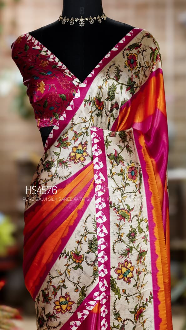 Pure Gajji Silk Saree with Kalamkari floral print, vibrant orange and rani pink Sibori design, Khaddi zari pallu, and elegant traditional festive wear look.