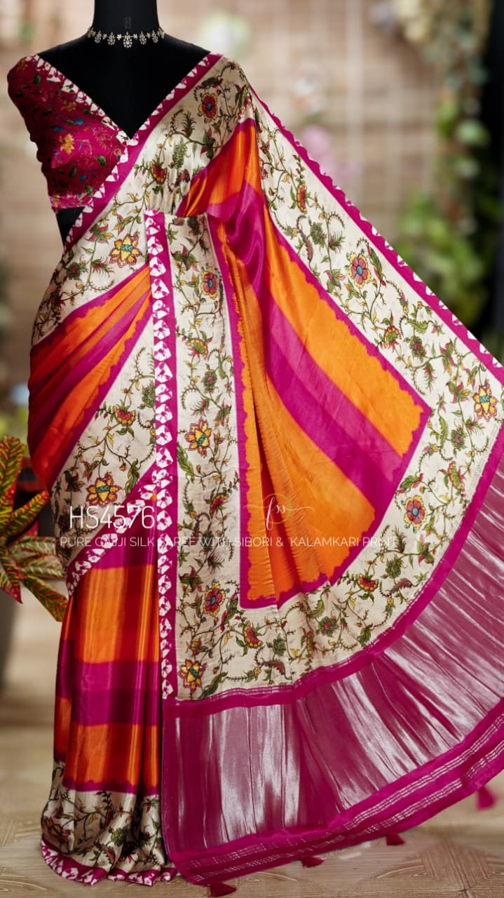 Pure Gajji Silk Saree with Kalamkari floral print, vibrant orange and rani pink Sibori design, Khaddi zari pallu, and elegant traditional festive wear look.