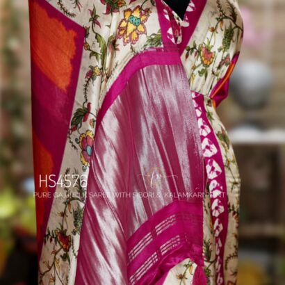 Pure Gajji Silk Saree with Kalamkari floral print, vibrant orange and rani pink Sibori design, Khaddi zari pallu, and elegant traditional festive wear look.