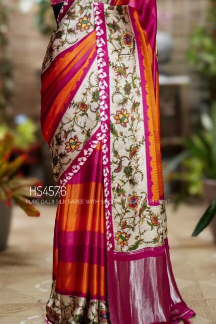 Pure Gajji Silk Saree with Kalamkari floral print, vibrant orange and rani pink Sibori design, Khaddi zari pallu, and elegant traditional festive wear look.