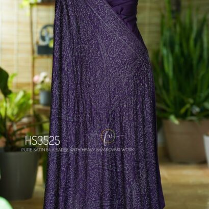 Purple Satin Silk Saree with Swarovski Work featuring a luxurious glossy finish, elegant drape, sparkling embellishments, and matching bordered blouse for partywear and wedding occasions.