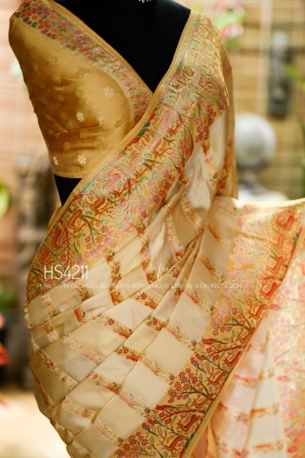 Cream Multicolor Satin Organza Silk Saree with sunset stripe pattern, rangkat dyeing, brocade border, woven buties and elegant pastel gradient design.