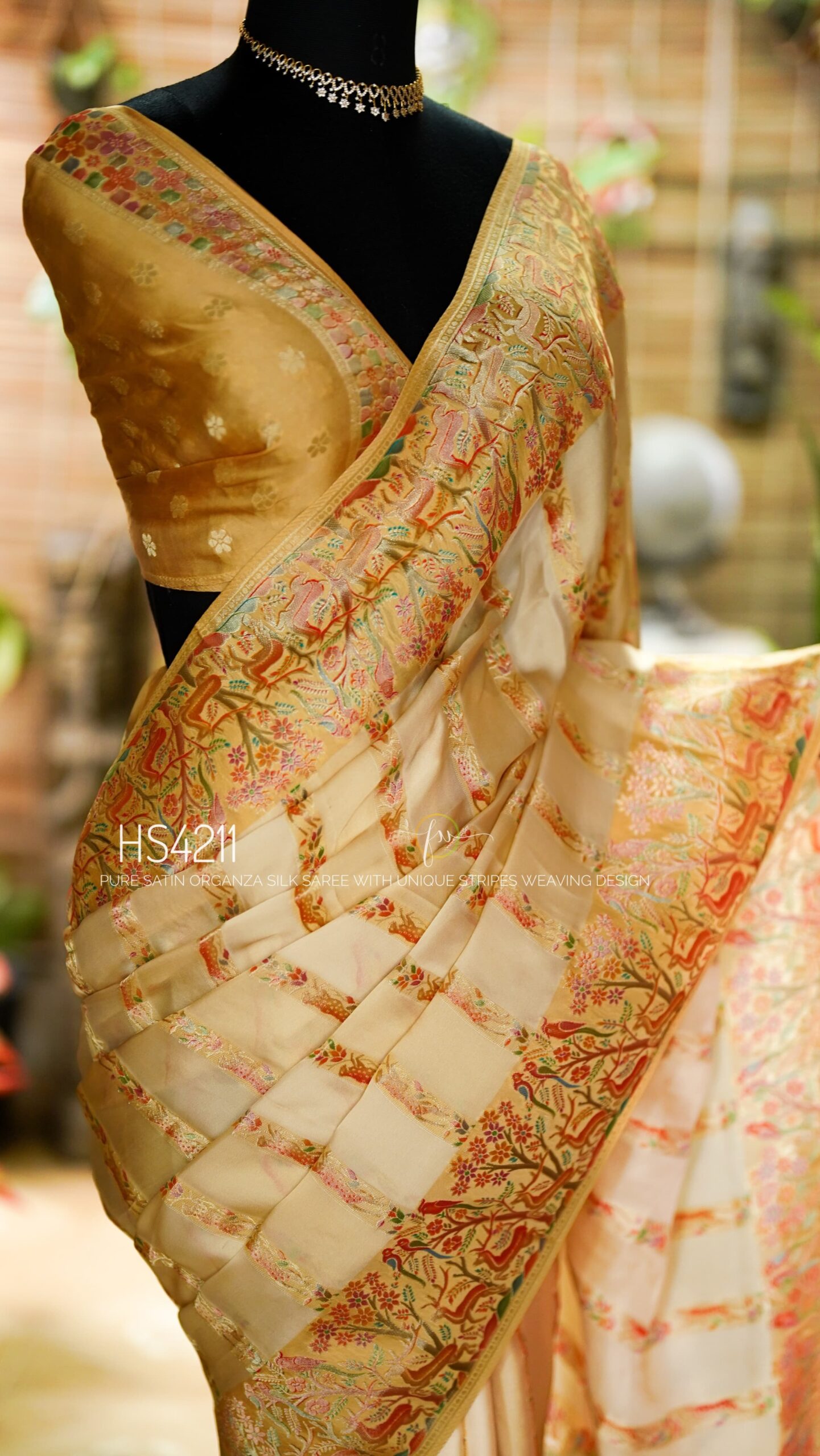 Cream Multicolor Satin Organza Silk Saree with sunset stripe pattern, rangkat dyeing, brocade border, woven buties and elegant pastel gradient design.