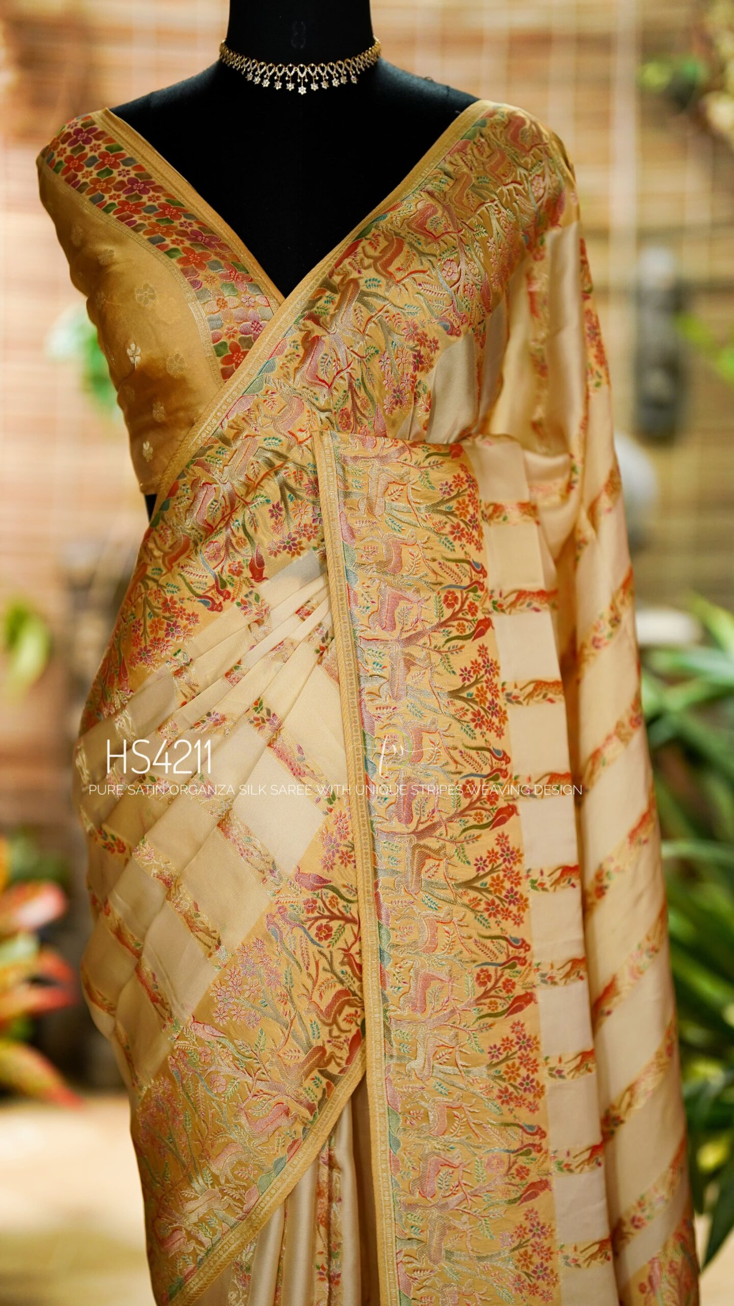 Cream Multicolor Satin Organza Silk Saree with sunset stripe pattern, rangkat dyeing, brocade border, woven buties and elegant pastel gradient design.
