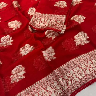 Viscose Georgette Saree with Contrast Blouse in Red Gold shade featuring floral zari motifs and elegant woven border.