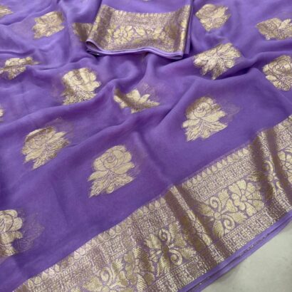Viscose Georgette Saree with Contrast Blouse in Lavender Purple Gold shade featuring floral zari motifs and elegant woven border.