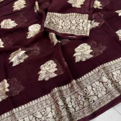 Viscose Georgette Saree with Contrast Blouse in Wine Maroon Gold shade featuring floral zari motifs and elegant woven border.