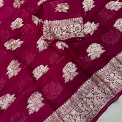 Viscose Georgette Saree with Contrast Blouse in Rani Pink Gold shade featuring floral zari motifs and elegant woven border.