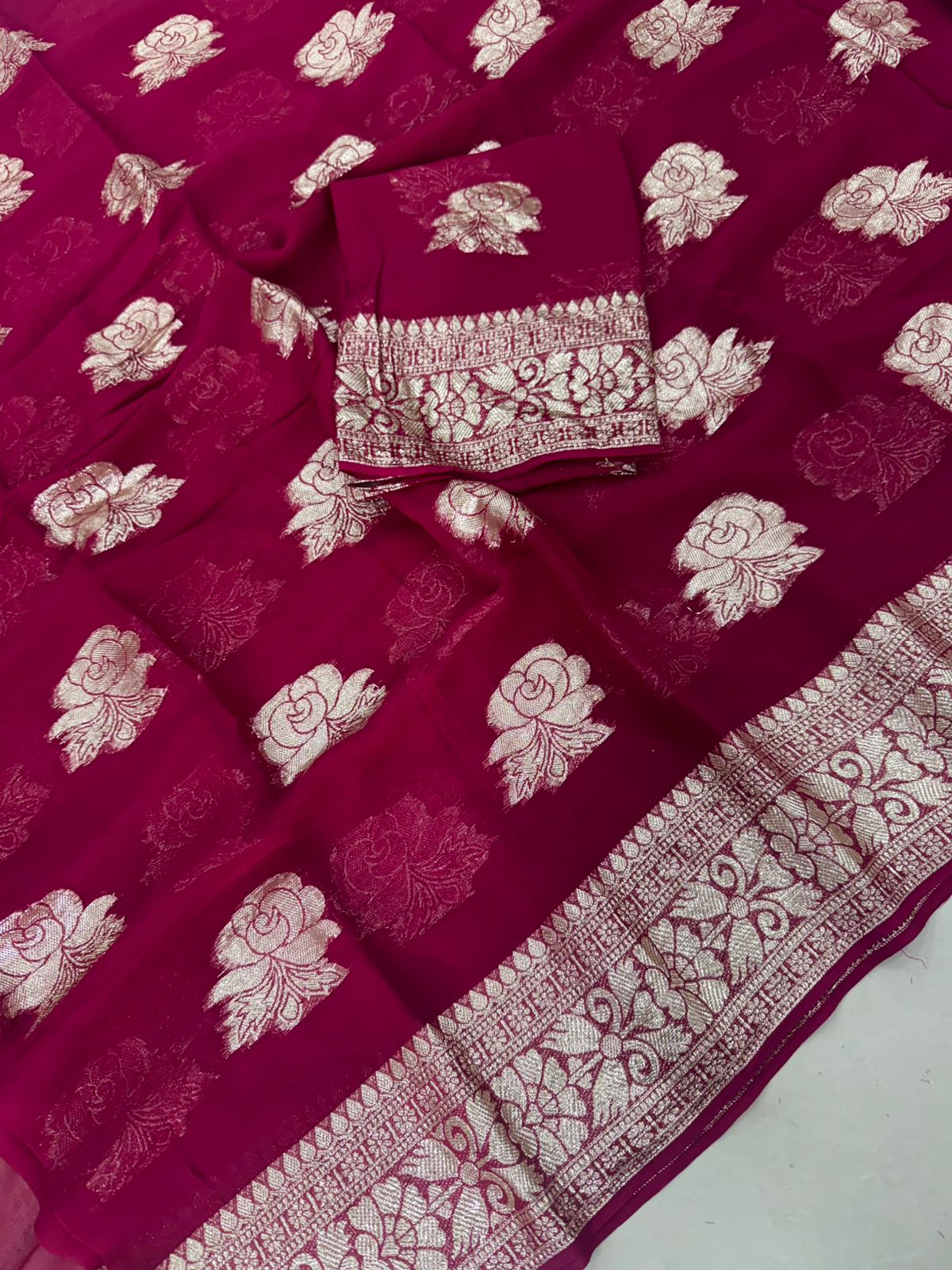 Viscose Georgette Saree with Contrast Blouse in Rani Pink Gold shade featuring floral zari motifs and elegant woven border.