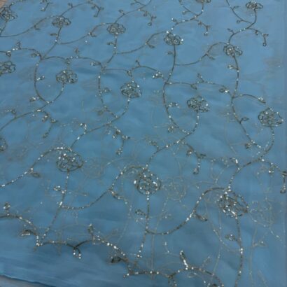 Royal Georgette Aari Work Saree in Sky Blue Color featuring intricate Aari Tari embroidery, elegant drape, premium georgette fabric, and graceful ethnic party wear look.