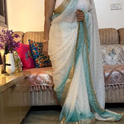 White & Sky Blue Fendi Satin Silk Saree with self-weaving jacquard, elegant buttis, ombre design, fancy golden jhalar lace border, and matching running blouse for festive, party, and wedding wear.