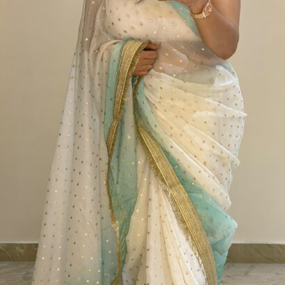White & Sky Blue Fendi Satin Silk Saree with self-weaving jacquard, elegant buttis, ombre design, fancy golden jhalar lace border, and matching running blouse for festive, party, and wedding wear.