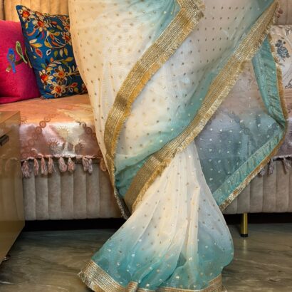 White & Sky Blue Fendi Satin Silk Saree with self-weaving jacquard, elegant buttis, ombre design, fancy golden jhalar lace border, and matching running blouse for festive, party, and wedding wear.