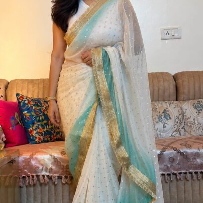 White & Sky Blue Fendi Satin Silk Saree with self-weaving jacquard, elegant buttis, ombre design, fancy golden jhalar lace border, and matching running blouse for festive, party, and wedding wear.