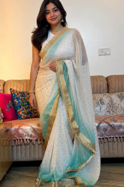 White & Sky Blue Fendi Satin Silk Saree with self-weaving jacquard, elegant buttis, ombre design, fancy golden jhalar lace border, and matching running blouse for festive, party, and wedding wear.
