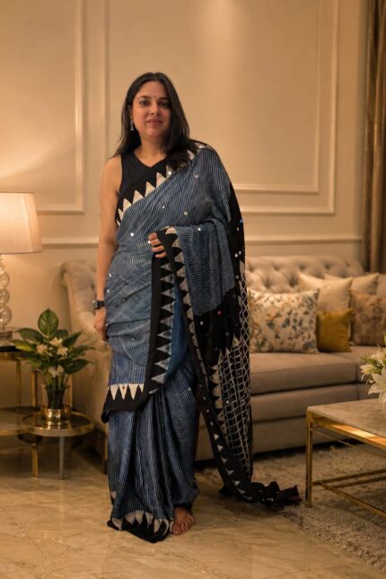 Pure Modal Silk Saree in Navy Blue with natural dye hand block print, 500 hand-pasted mirror work, striped design and designer pallu for festive, wedding and party wear.