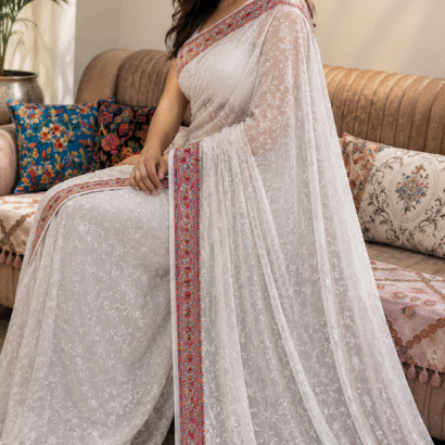 White pure georgette saree with intricate Kashmiri border and Chikankari embroidery body