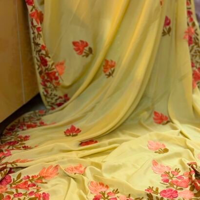 Yellow Kashmiri Silk Saree with Aari Resham embroidery featuring authentic Aari Resham border embroidery and running blouse piece.