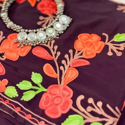 Wine purple Kashmiri pure crepe silk saree featuring authentic Aari Resham border embroidery and running blouse piece.