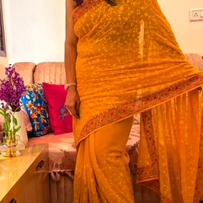 Yellow pure georgette saree with intricate Kashmiri border and Chikankari embroidery body
