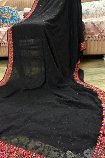Black pure georgette saree with intricate Kashmiri border and Chikankari embroidery body