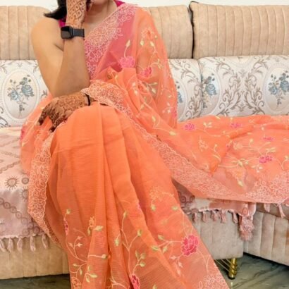 Peach Kota Doria saree with floral Parsi embroidery