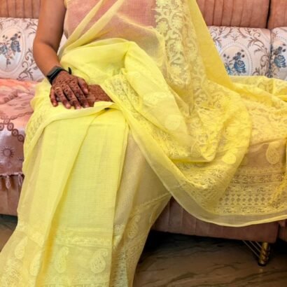 Yellow Kota Doria Saree with floral Parsi embroidery and white border