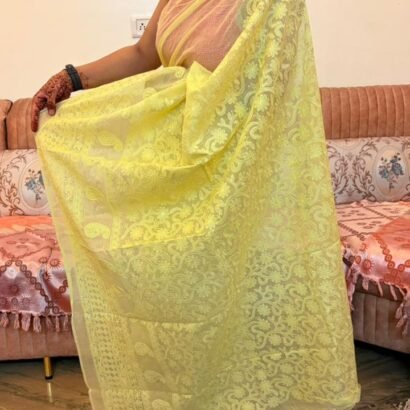 Yellow Kota Doria Saree with floral Parsi embroidery and white border