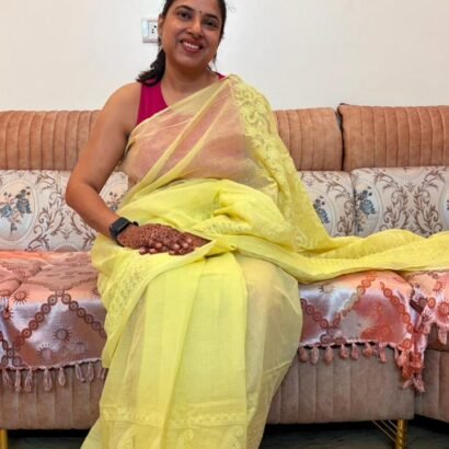 Yellow Kota Doria Saree with floral Parsi embroidery and white border