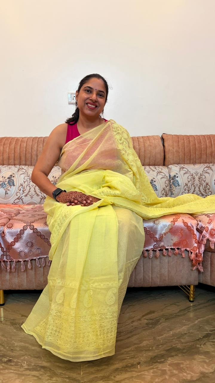 Yellow Kota Doria Saree with floral Parsi embroidery and white border