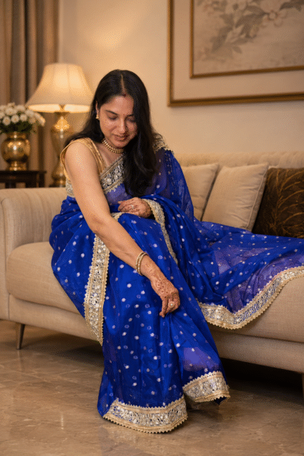 Royal blue Pure Banarasi silk saree featuring gold zari floral booti weaving and Sabyasachi-style mirror work lace border
