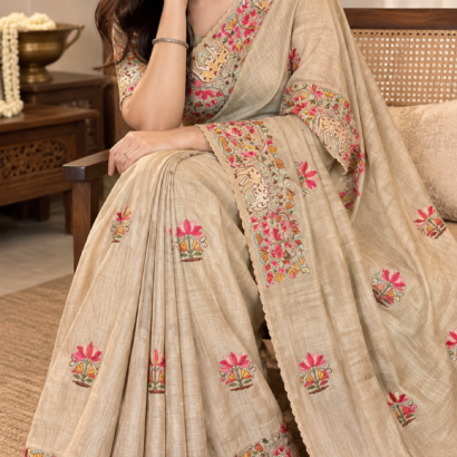 Elegant handloom tussar silk saree with paichwai embroidery, scalloped border and lotus-cow motifs
