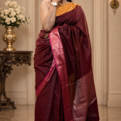 Deep maroon handloom silk saree with mustard gold blouse and zari border
