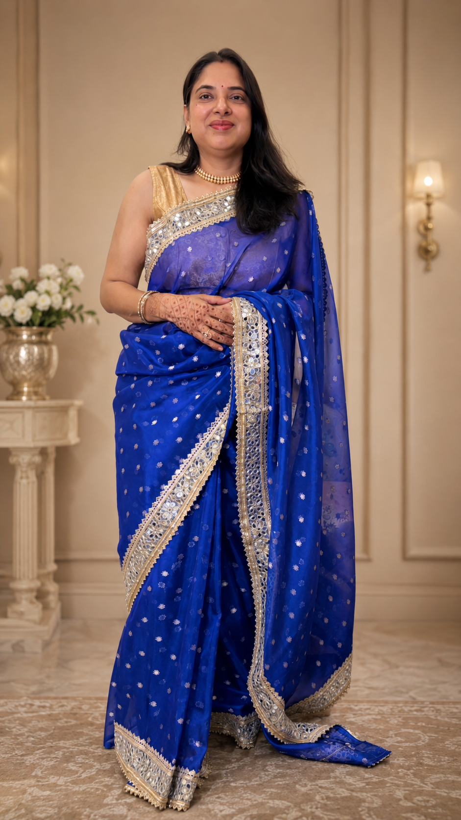 Royal blue Pure Banarasi silk saree Royal blue Pure Banarasi silk saree featuring gold zari floral booti weaving and Sabyasachi-style mirror work lace border